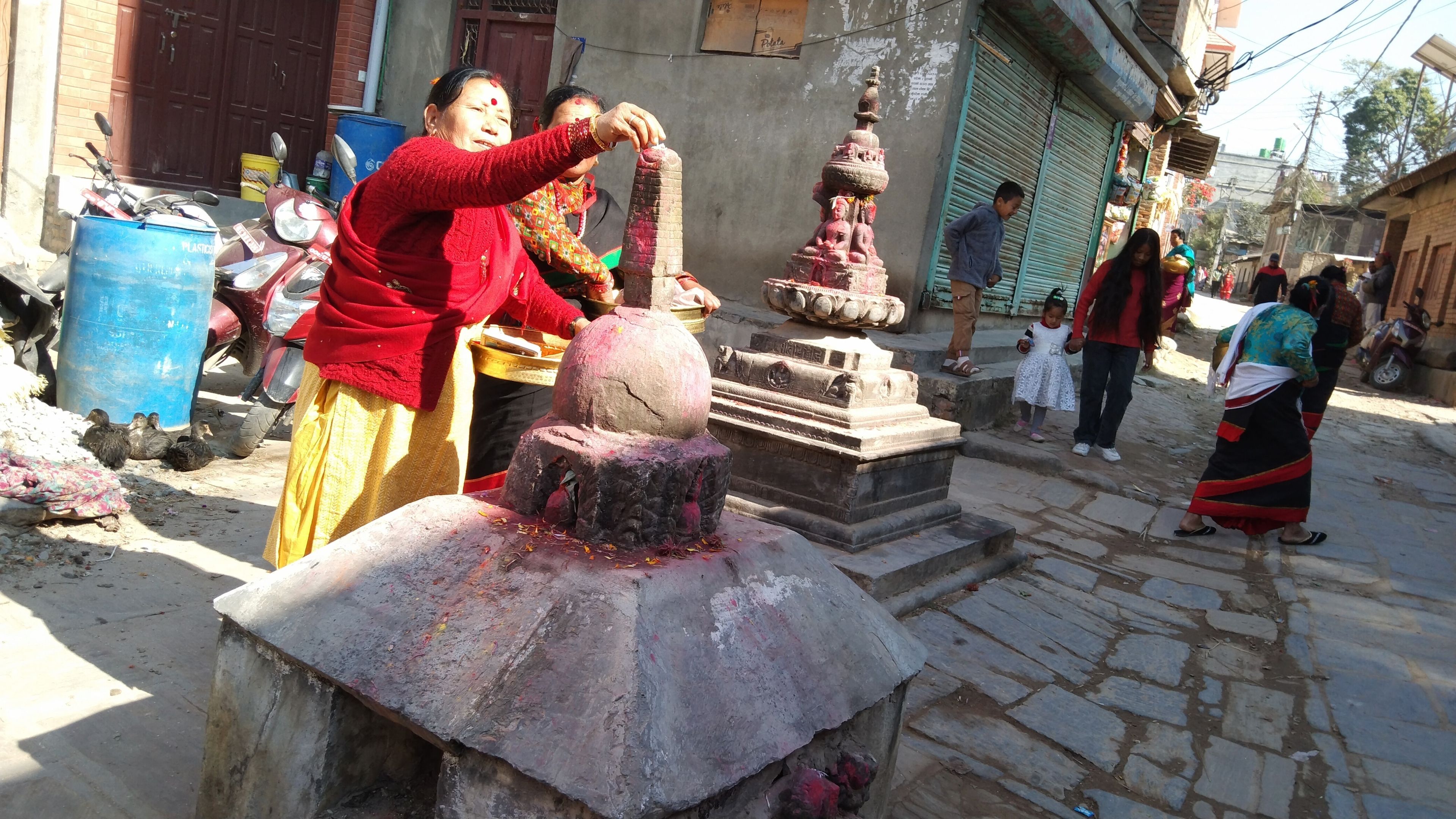 Women worshipping at a shrine in Bangmati Village, from where a Shreedhar Vishnu idol was stolen. The idol would later appear in the collection of New York's Metropolitan Museum of Art